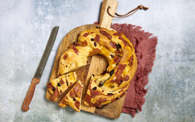 Crown-shaped savory cake filled with salame calabrese and olives